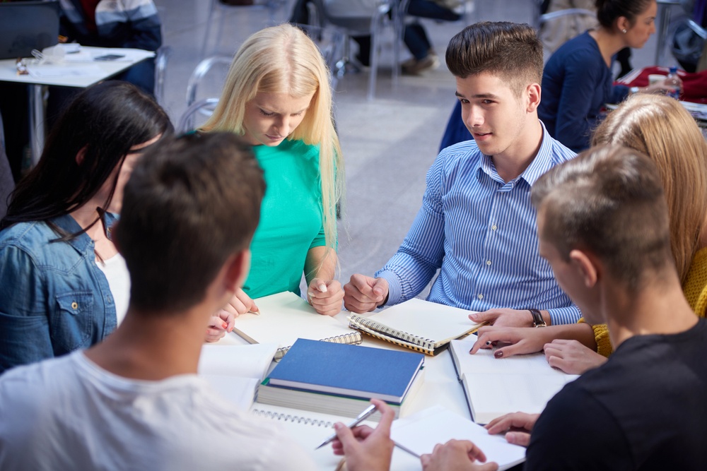happy students group study in classroom.jpeg