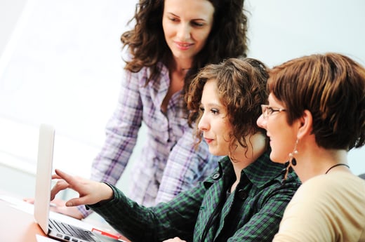 While  meeting, group of young women working together on the table-1